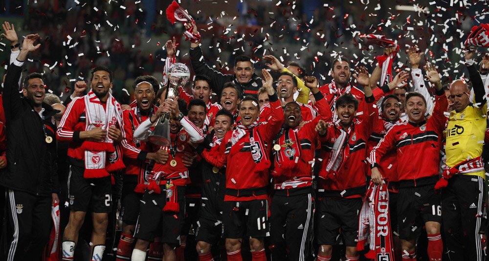 Benfica's players celebrate with their trophy after winning the Portuguese League Cup final against Rio Ave in Leiria